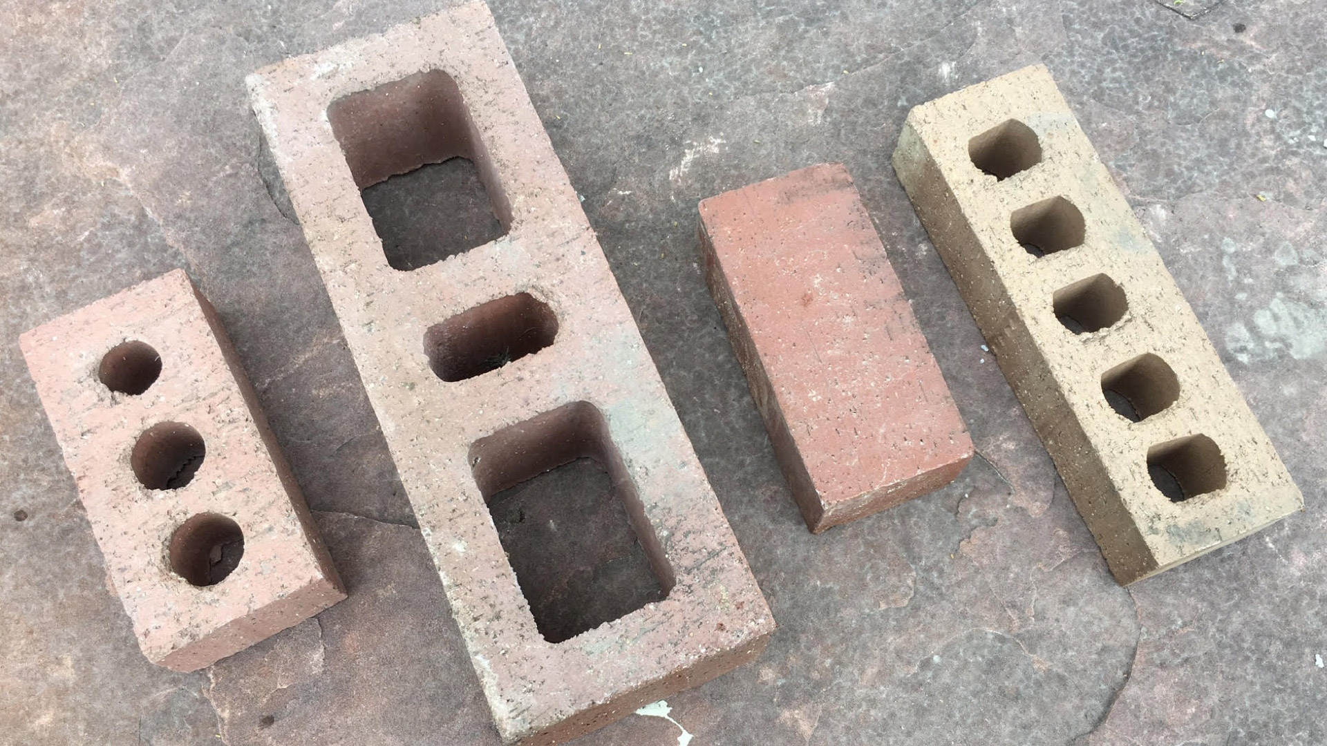 From left: face brick, hollow brick, paving brick, building brick. From left: face brick, hollow brick, paving brick, building brick.