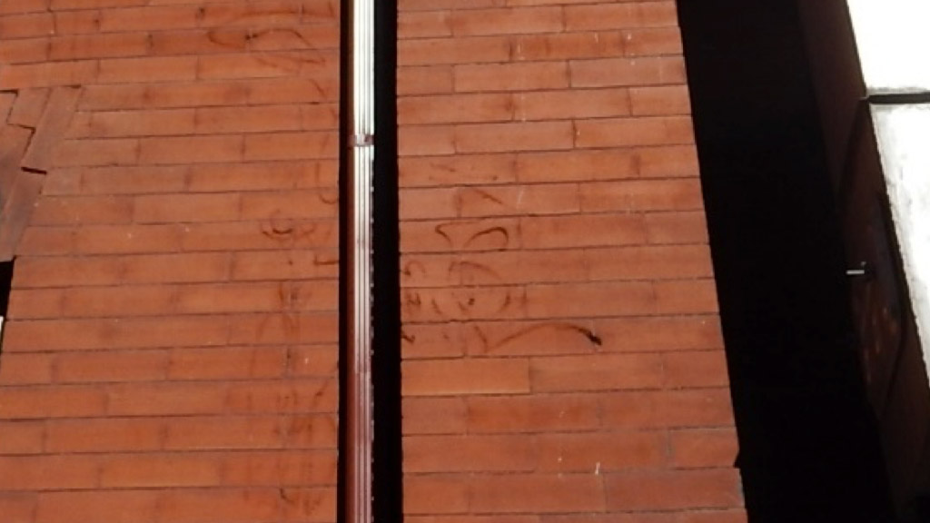 Example of brick scarring left by pressure washing.